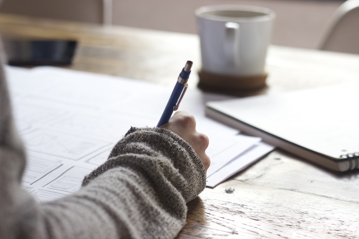 Planner and pens on a desk for scheduling